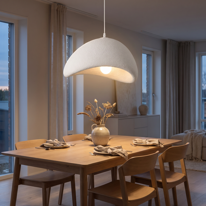 Zenith Glow modern LED chandelier glowing above a Scandinavian dining table
